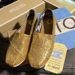 Toms gold slip on shoes for girls